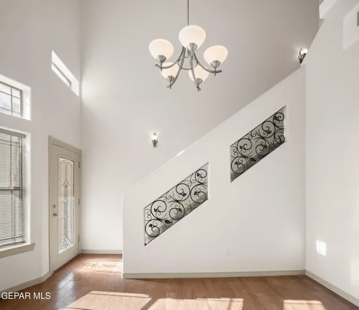 a view of a hallway with chandelier