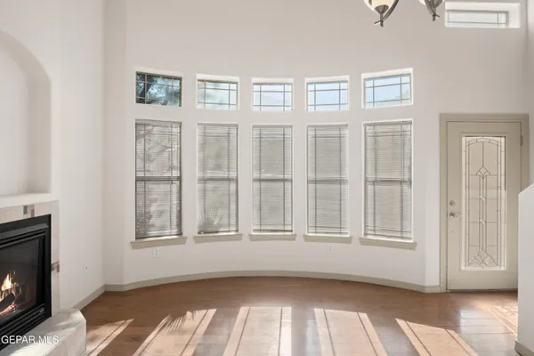 a view of an empty room with a fireplace