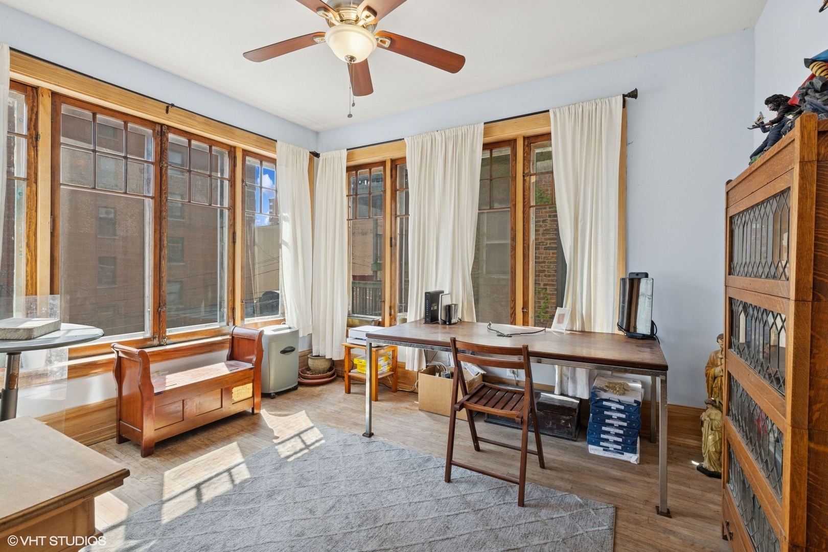 5863 North Kenmore Avenue, Unit 2 Chicago, IL 60660 - Photo 19 of 26 a living room with furniture and large windows