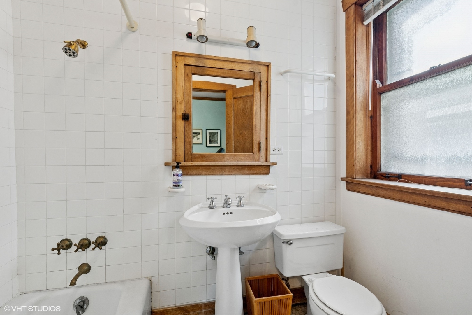 5863 North Kenmore Avenue, Unit 2 Chicago, IL 60660 - Photo 20 of 26 a bathroom with a sink toilet and mirror