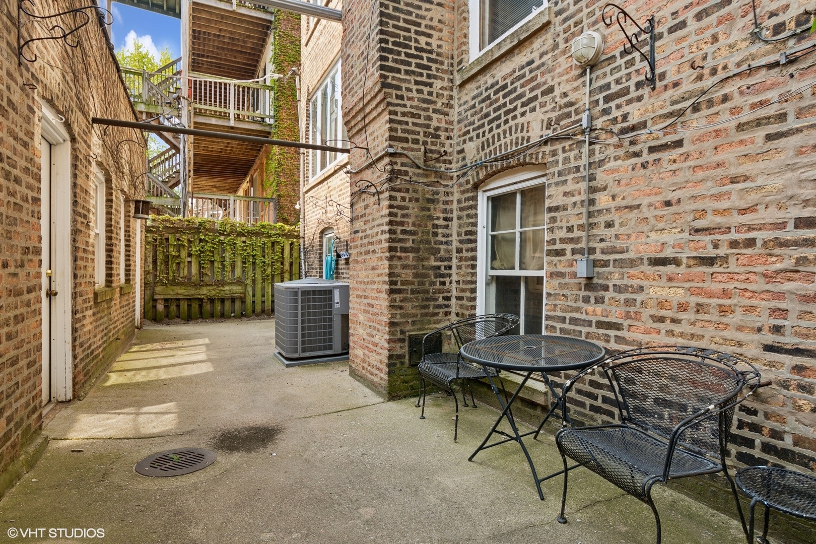 5863 North Kenmore Avenue, Unit 2 Chicago, IL 60660 - Photo 23 of 26 a view of a chairs and table in the patio