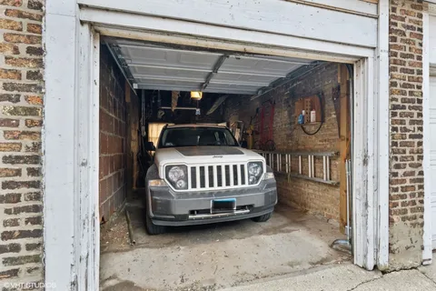 a view of a porch with a hanging chair