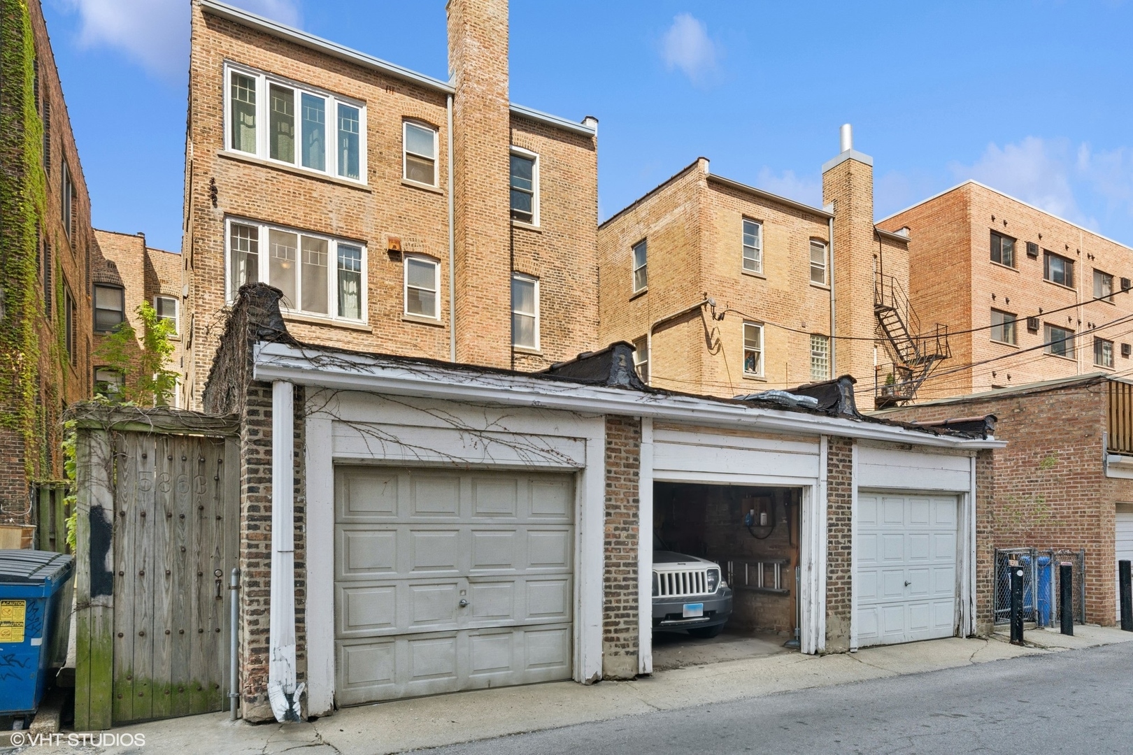 5863 North Kenmore Avenue, Unit 2 Chicago, IL 60660 - Photo 25 of 26 a front view of a building with garage