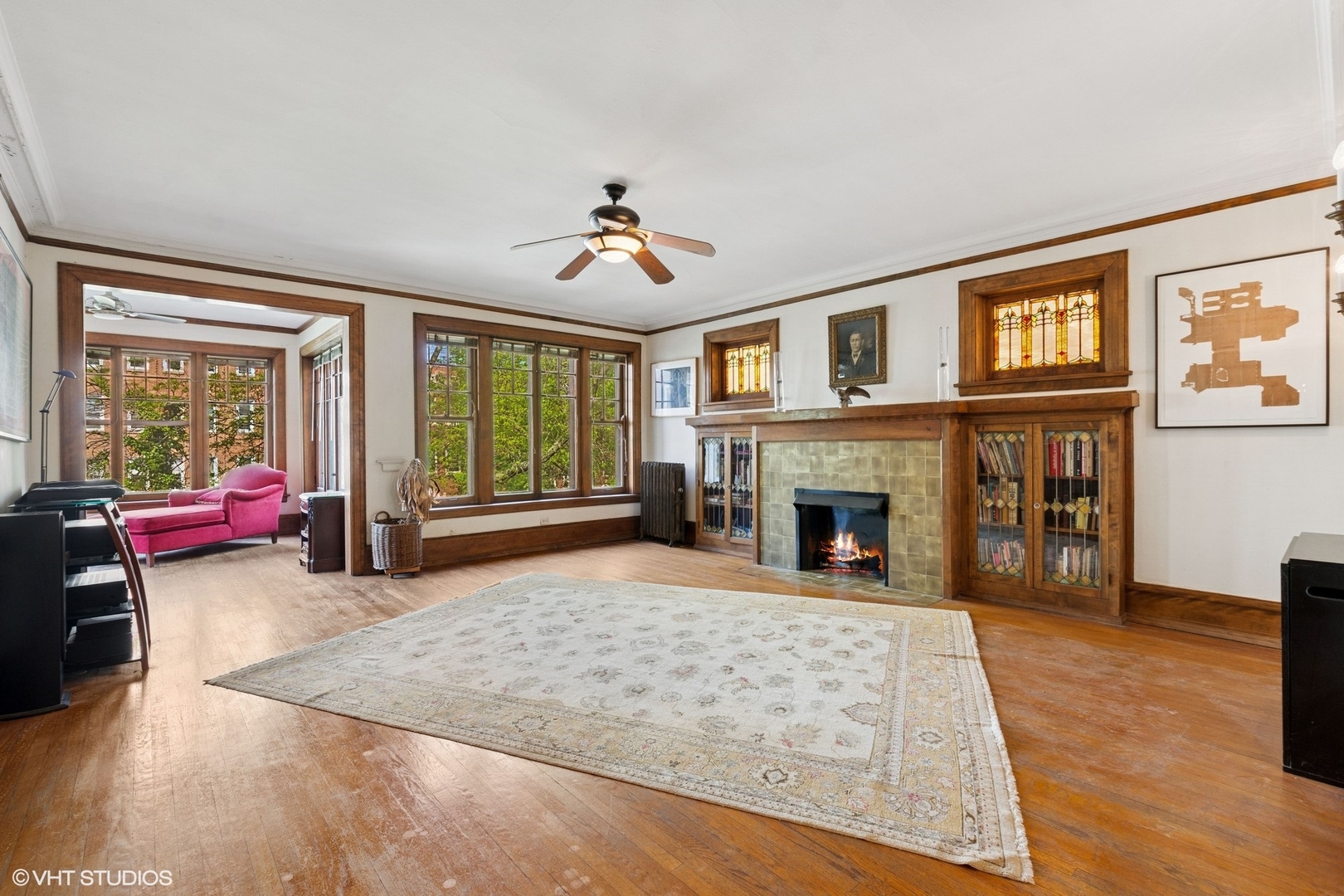 5863 North Kenmore Avenue, Unit 2 Chicago, IL 60660 - Photo 3 of 26 a living room with furniture large window and fireplace