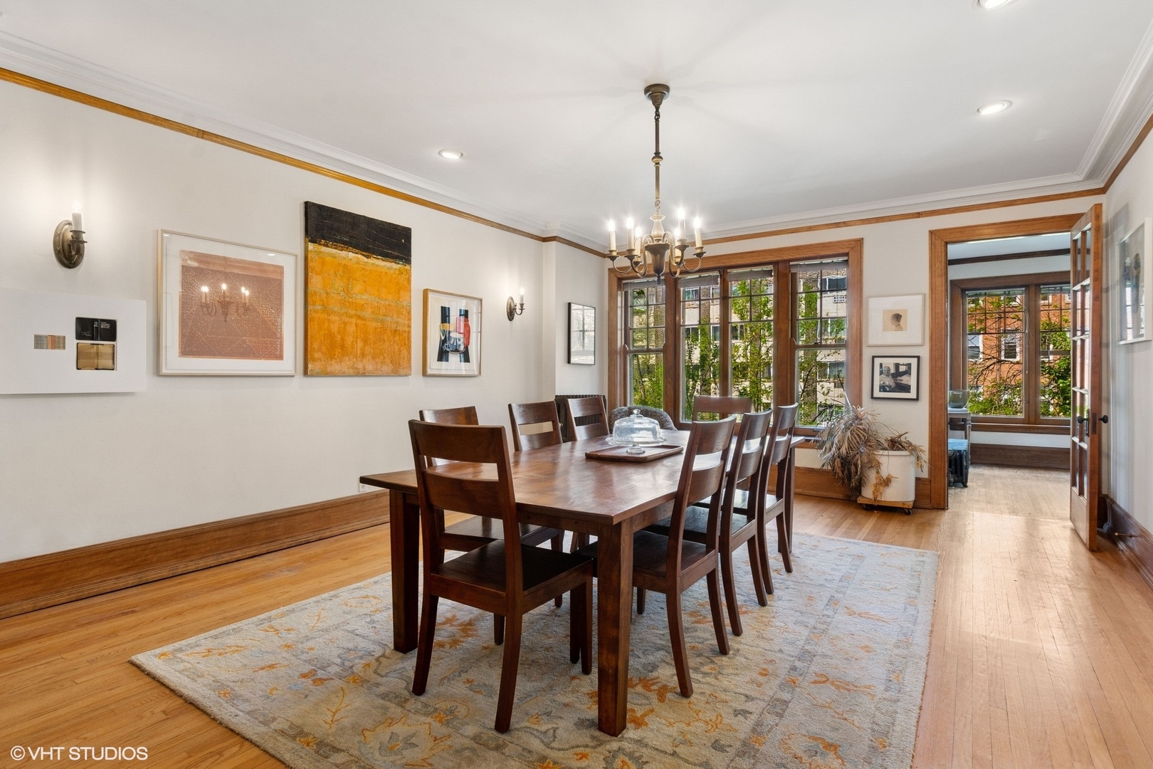 5863 North Kenmore Avenue, Unit 2 Chicago, IL 60660 - Photo 8 of 26 a view of a dining room with furniture window and wooden floor