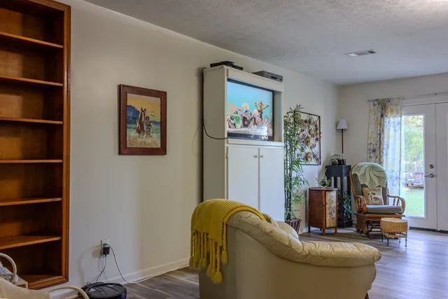 a living room with furniture and a window