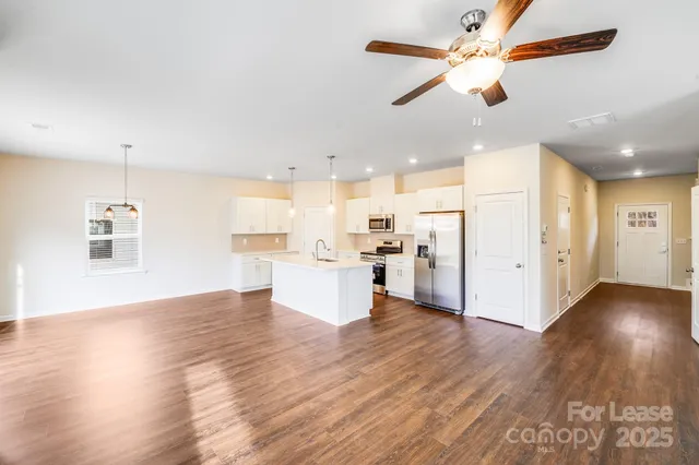 a view of kitchen with wooden floor and window