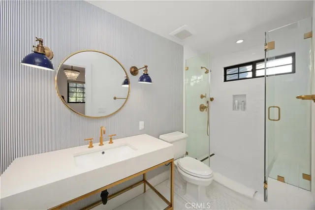 a living room with patio furniture and a potted plant