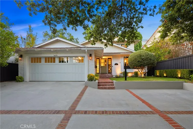 a view of a house with a small yard
