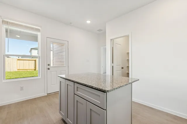 an entryway with wooden floor