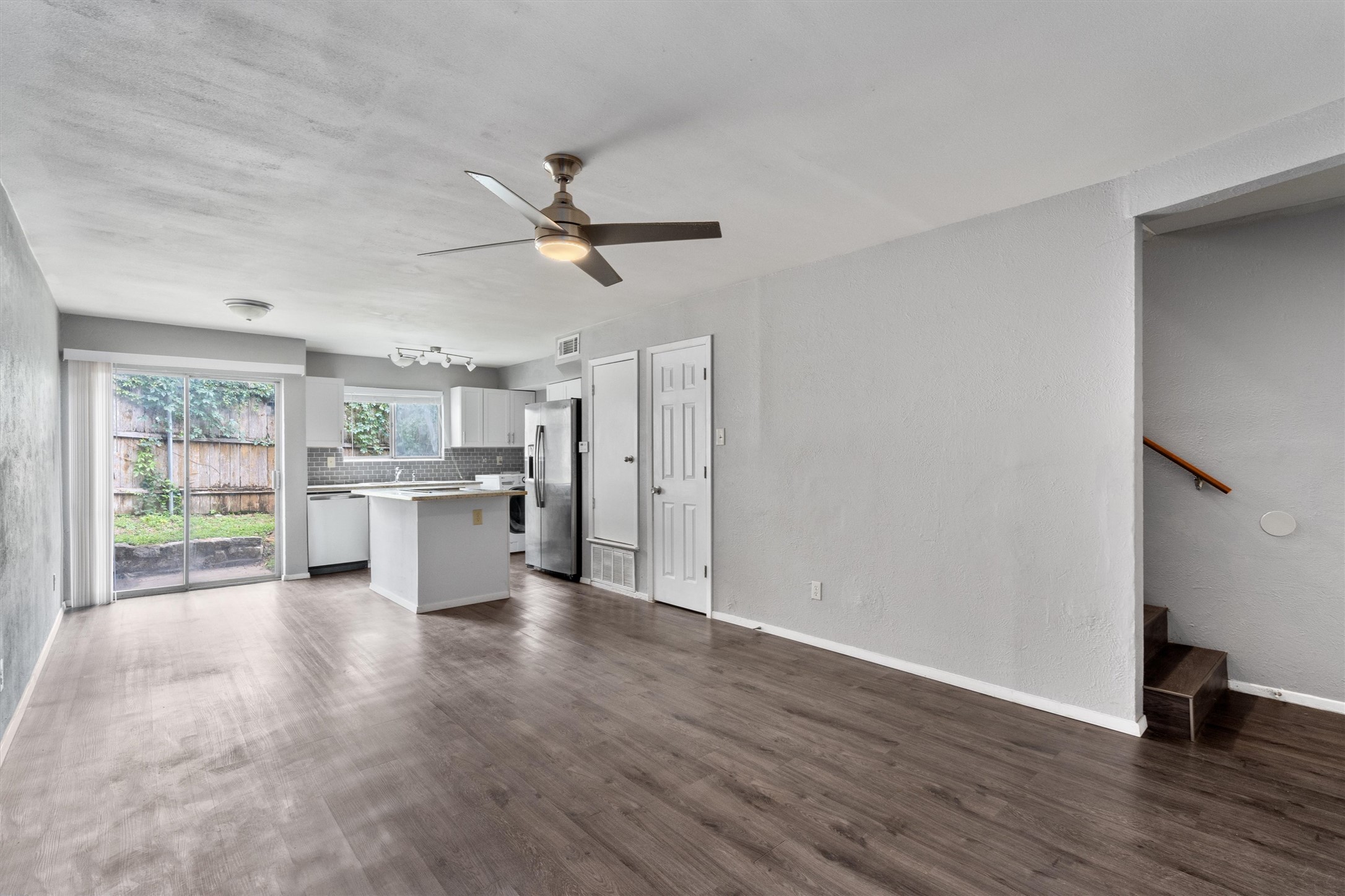 3415 Menchaca Road, Unit 113 Austin, TX 78704 - Photo 4 of 21 a view of a living room hardwood floor and a window
