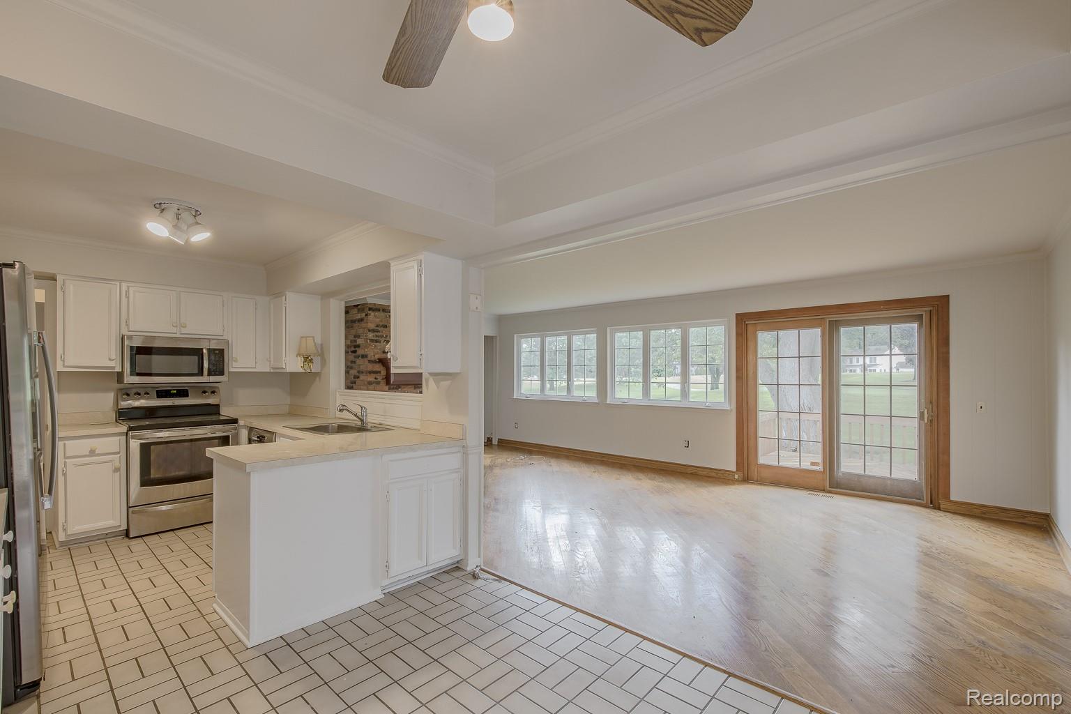 710 Basswood Drive Rochester, MI 48309 - Photo 14 of 42 Kitchen overlooking the family room and view of backyard/golf course
