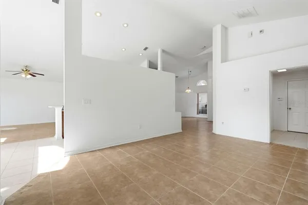 a view of a big room with closet and windows