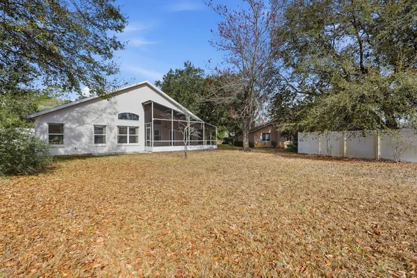 a house with trees in the background