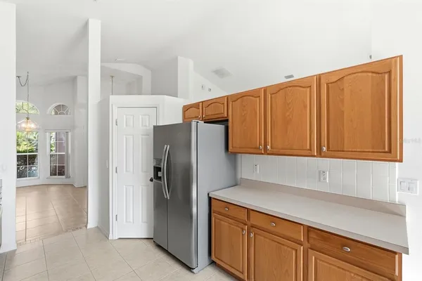 a kitchen with stainless steel appliances a refrigerator and cabinets