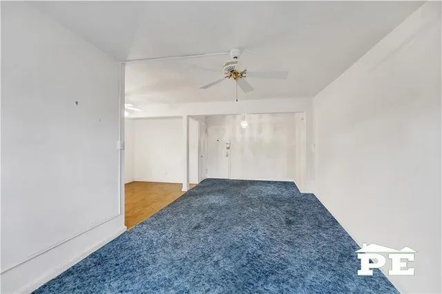 a view of livingroom with hardwood floor and a ceiling fan