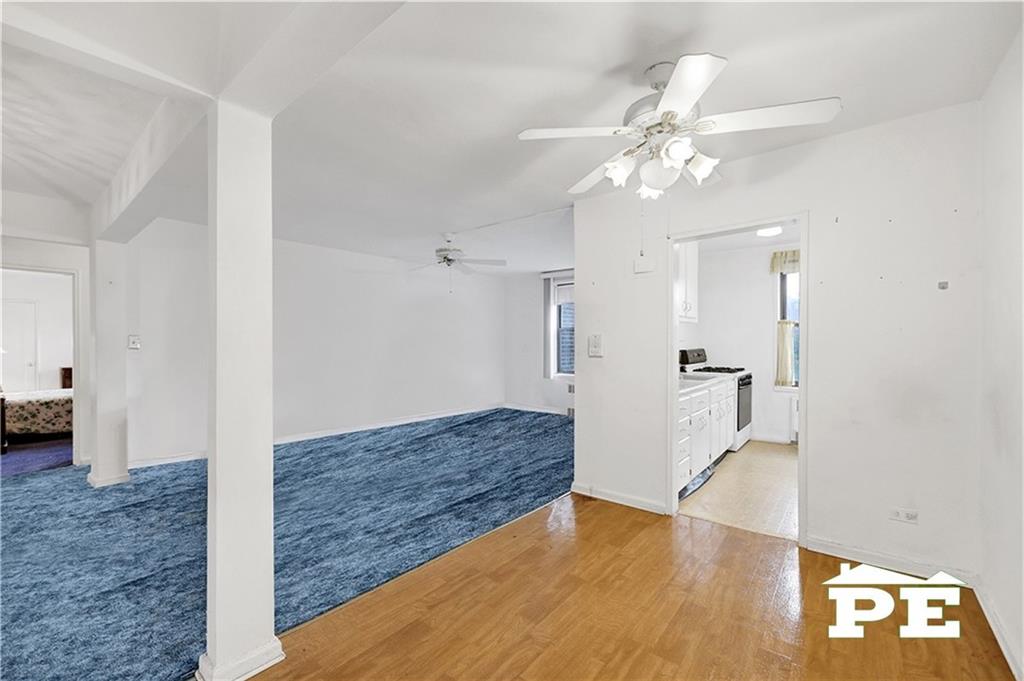 2425 Haring Street, Unit 4G Brooklyn, NY 11235 - Photo 13 of 29 a view of livingroom with hardwood floor and a ceiling fan