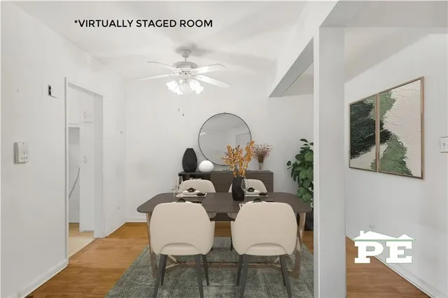 a spacious bathroom with a double vanity sink a mirror and a shower