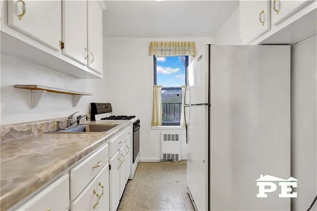 a spacious bathroom with a sink and a mirror