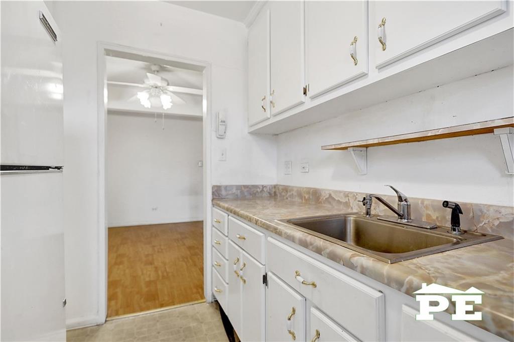 2425 Haring Street, Unit 4G Brooklyn, NY 11235 - Photo 18 of 29 a kitchen with cabinets and a sink