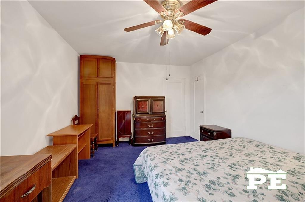 2425 Haring Street, Unit 4G Brooklyn, NY 11235 - Photo 23 of 29 a bedroom with a bed and wooden floor