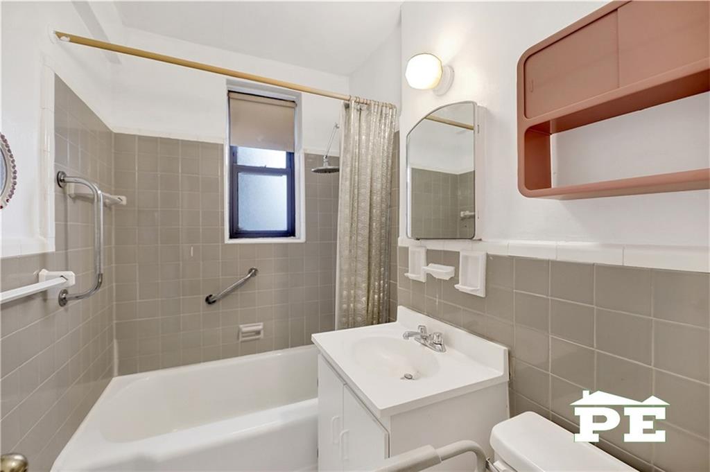 2425 Haring Street, Unit 4G Brooklyn, NY 11235 - Photo 24 of 29 a bathroom with a sink toilet and shower