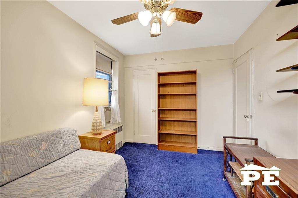 2425 Haring Street, Unit 4G Brooklyn, NY 11235 - Photo 26 of 29 a bedroom with furniture and a lamp