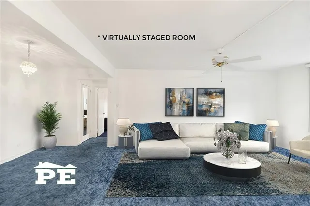 an empty room with windows and cabinet