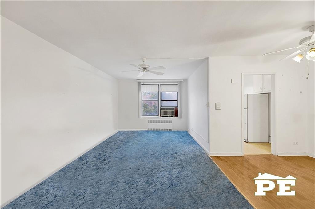 2425 Haring Street, Unit 4G Brooklyn, NY 11235 - Photo 9 of 29 a view of hallway with an empty room and wooden floor