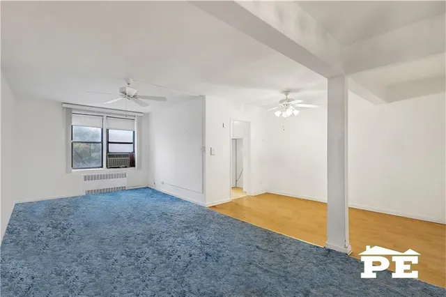 a living room with furniture wooden floor and a fireplace