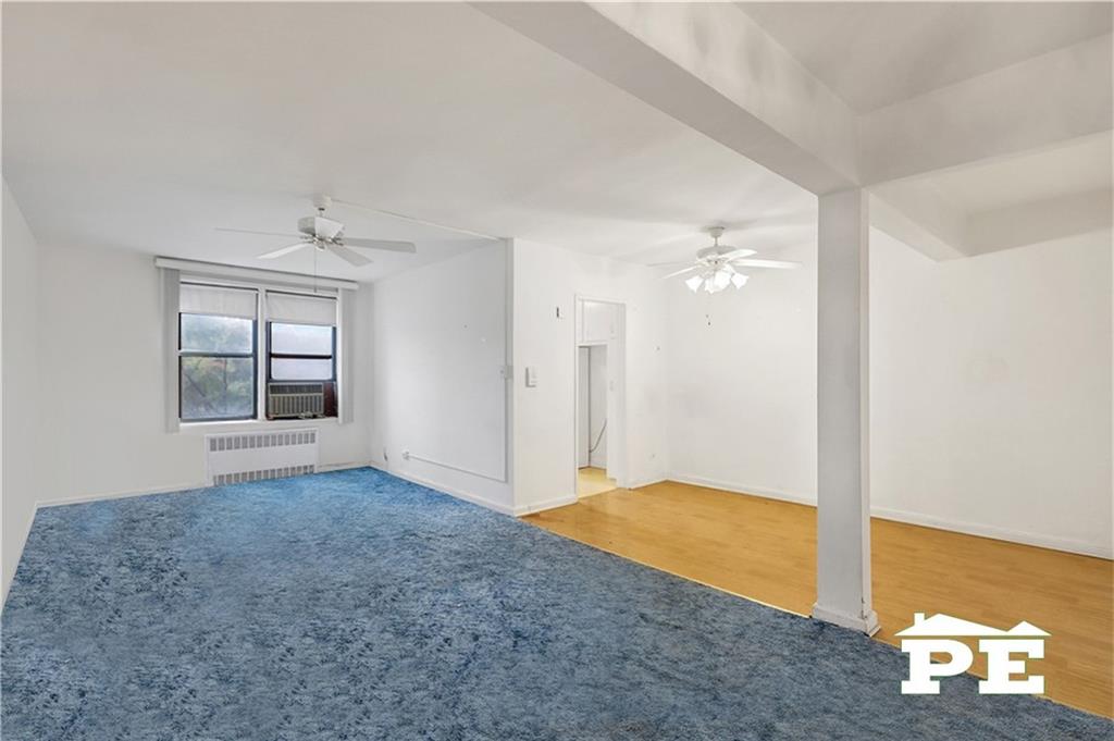 2425 Haring Street, Unit 4G Brooklyn, NY 11235 - Photo 10 of 29 wooden floor in an empty room with a window