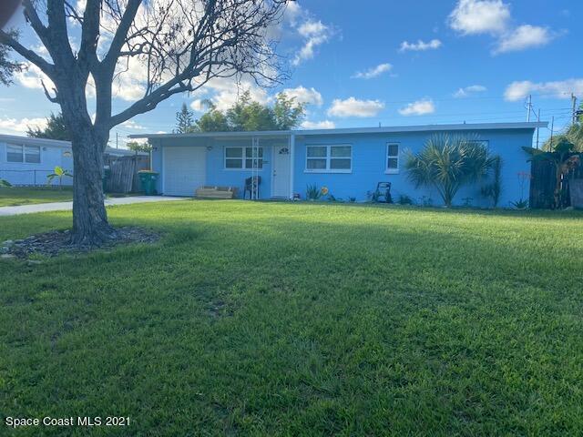 2310 King Richard Road Melbourne, FL 32935 - Photo 1 of 1 a front view of a house with garden