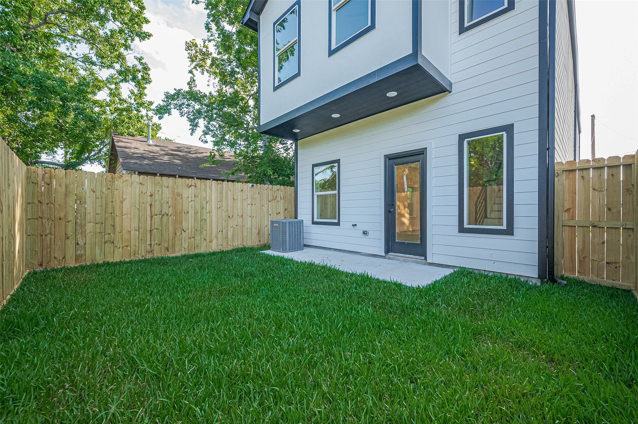 6747 Liverpool Street Houston, TX 77021 - Photo 2 of 18 Enjoy a low-maintenance yard that offers a safe and inviting space for children or pets to play.