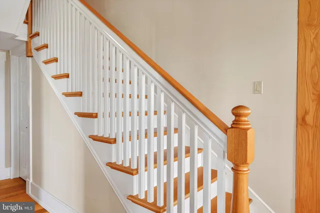 a view of a house with swimming pool and porch