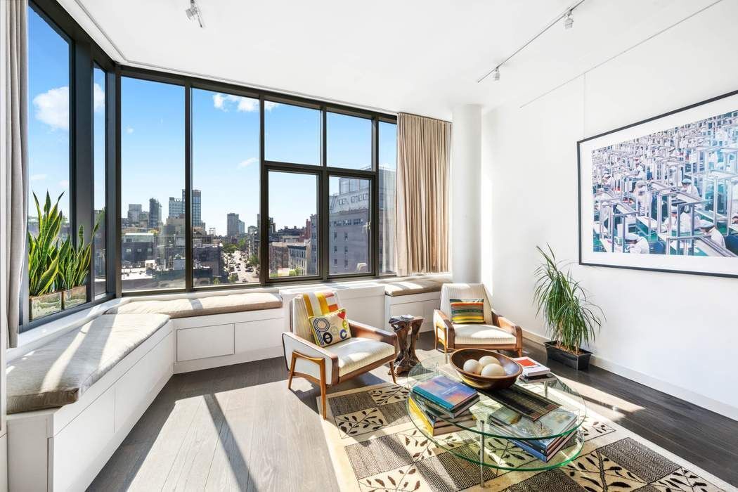 210 Lafayette Street, Unit 7A Manhattan, NY 10012 - Photo 2 of 13 a living room with furniture and floor to ceiling windows