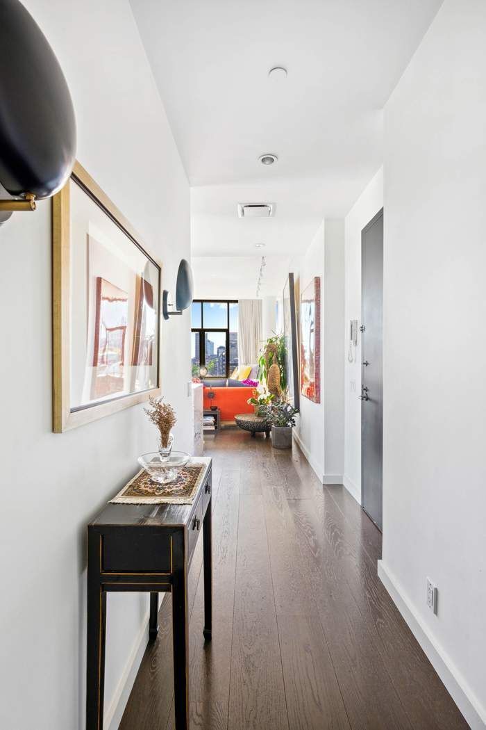 210 Lafayette Street, Unit 7A Manhattan, NY 10012 - Photo 6 of 13 a living room with furniture and a table