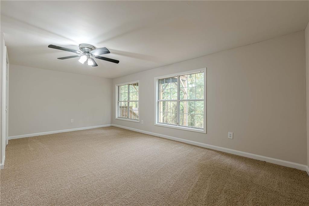 1276 To Lani Farm Road Stone Mountain, GA 30083 - Photo 14 of 16 a view of an empty room with a window
