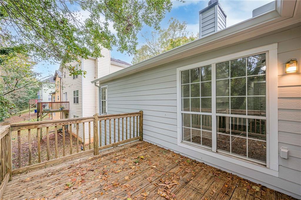 1276 To Lani Farm Road Stone Mountain, GA 30083 - Photo 16 of 16 a view of a house with a large window