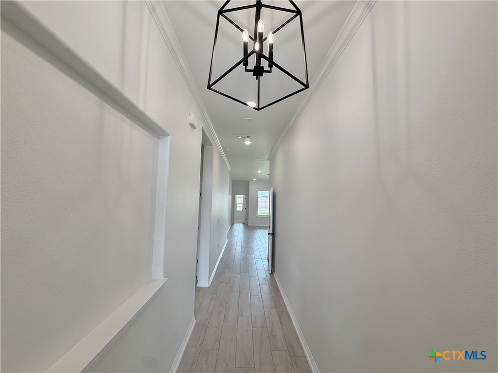 2016 Yarrow Road Temple, TX 76502 - Photo 2 of 30 a view of a hallway with wooden floor and staircase