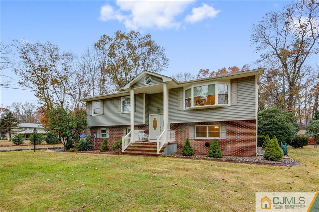 300 Aldrich Road Howell, NJ 07731 - Photo 2 of 19 a front view of a house with a yard