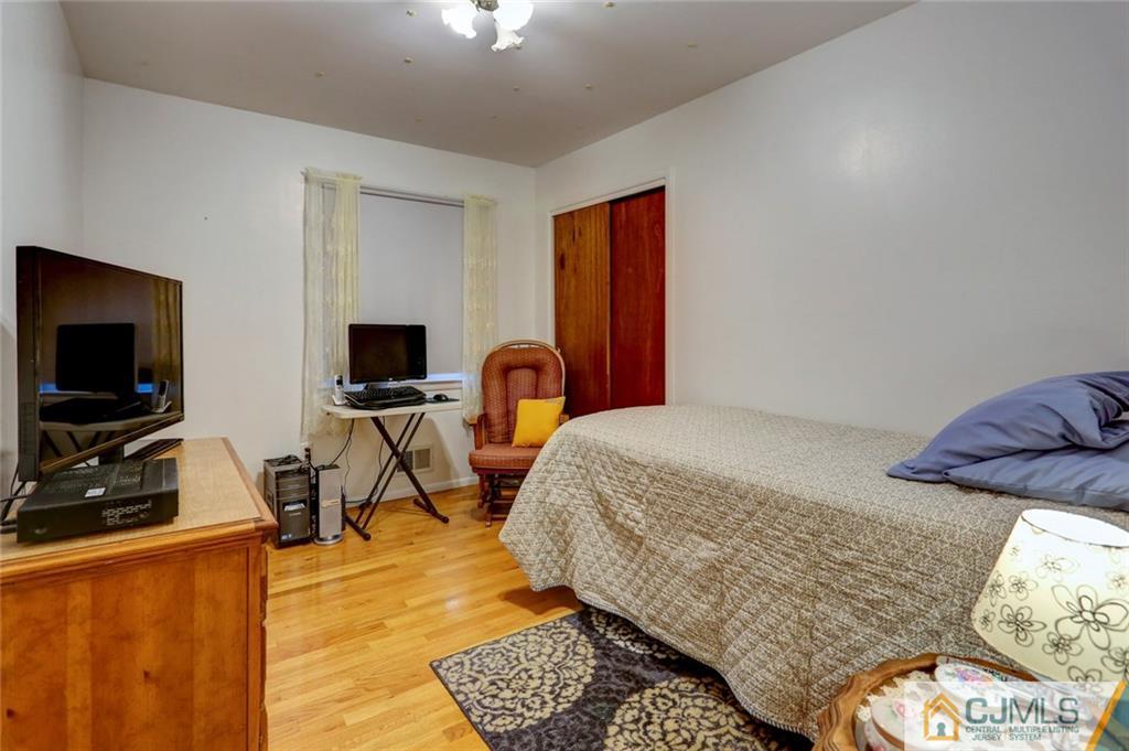300 Aldrich Road Howell, NJ 07731 - Photo 12 of 19 a bedroom with bed and flat screen tv