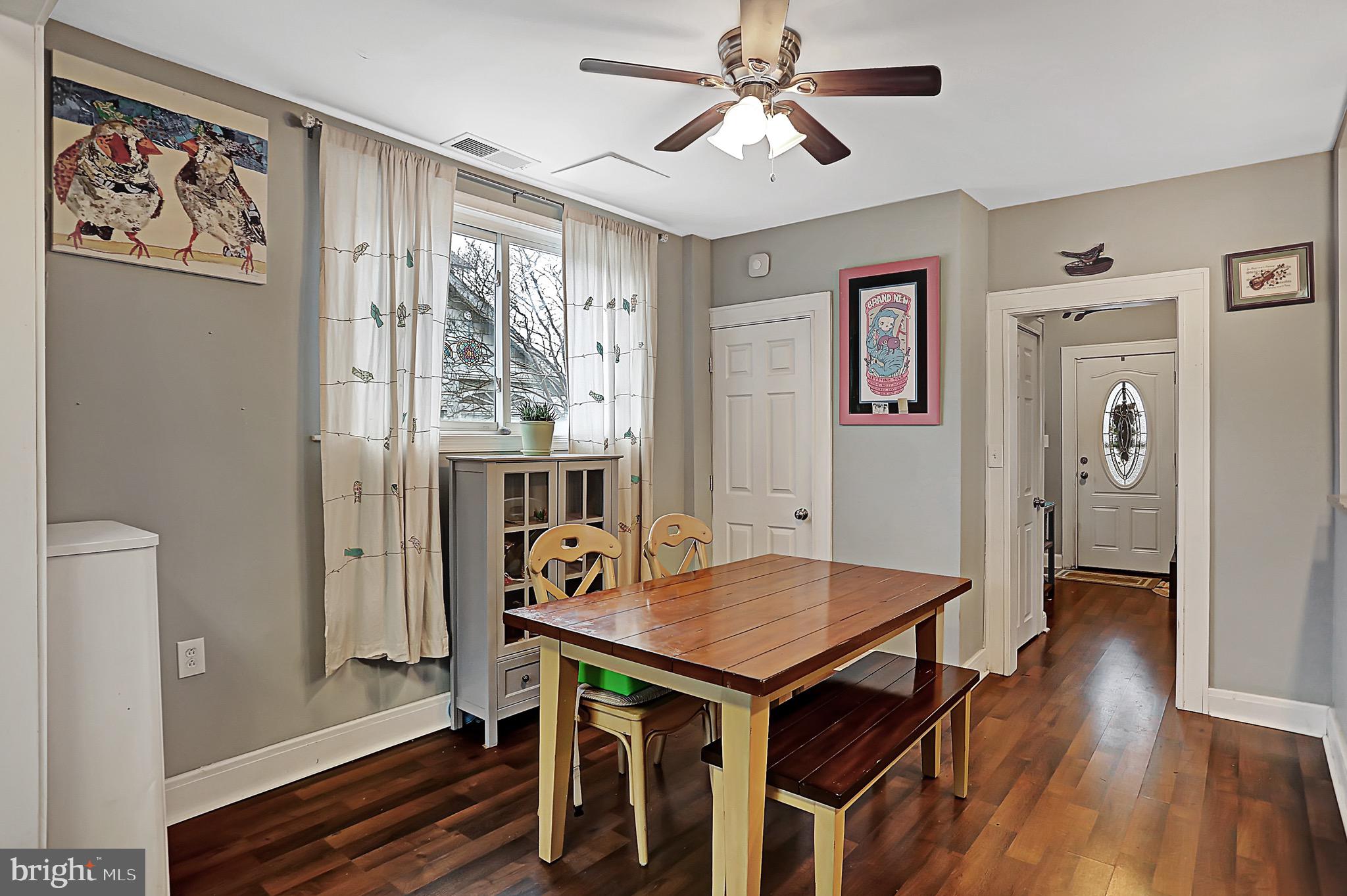 6811 Dunhill Road Baltimore, MD 21222 - Photo 14 of 36 a view of a dining room with furniture window and wooden floor