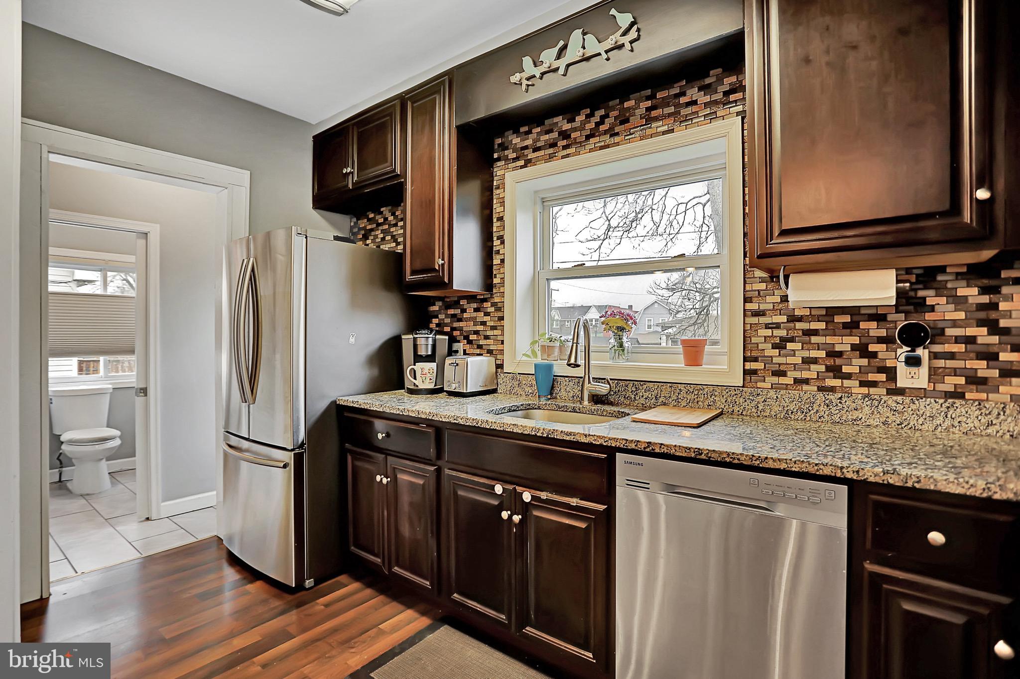 6811 Dunhill Road Baltimore, MD 21222 - Photo 8 of 36 a kitchen with stainless steel appliances granite countertop a refrigerator and a sink