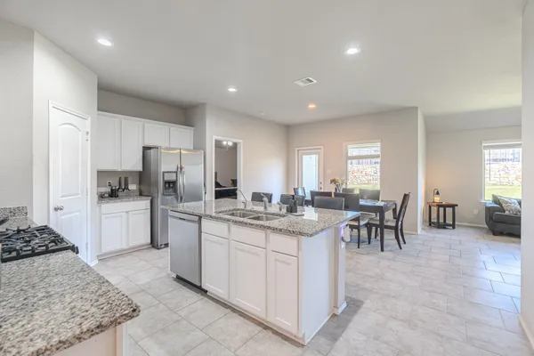a kitchen with lots of counter top space and appliances
