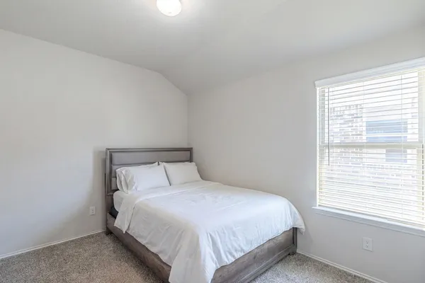 a view of a swimming pool with a yard