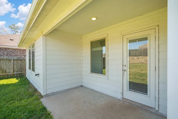 a view of a fountain in front of a house with a big yard