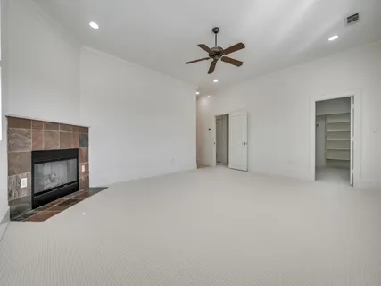a view of an empty room with a fireplace