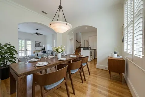a view of a dining room with furniture window and wooden floor
