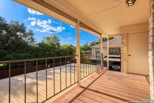 a view of balcony with a potted plant