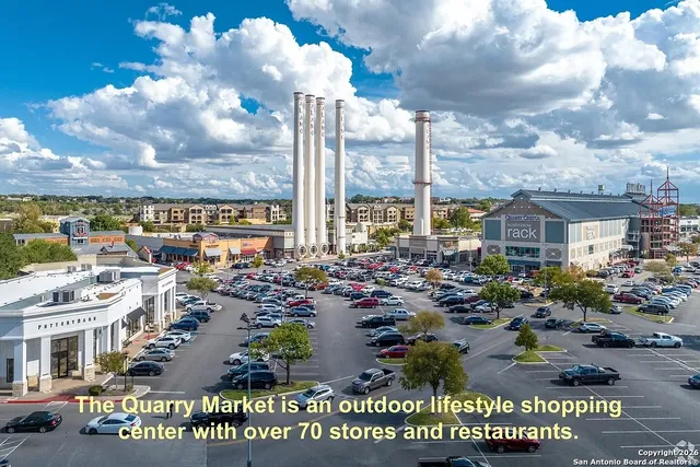 a front view of a building with lots of people